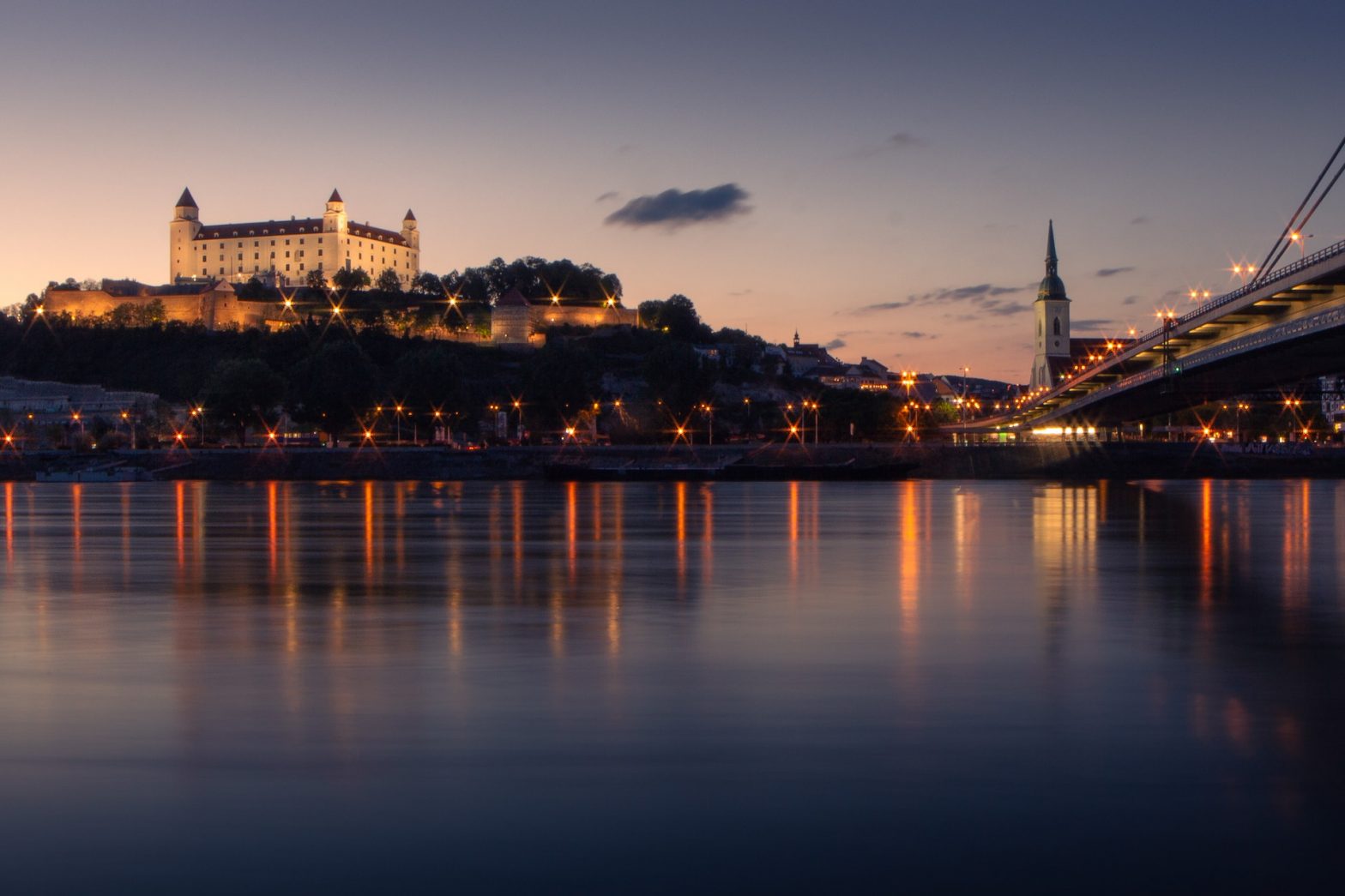 Bratislava Castle Towering Over Danube River at Sunset