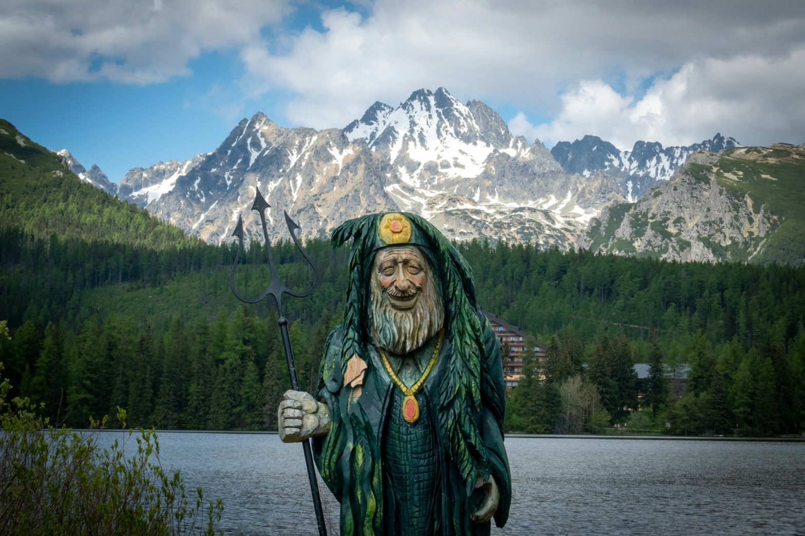 Štrbské Pleso Glacial Lake with Wooden Statue of Seasoned Aquaman